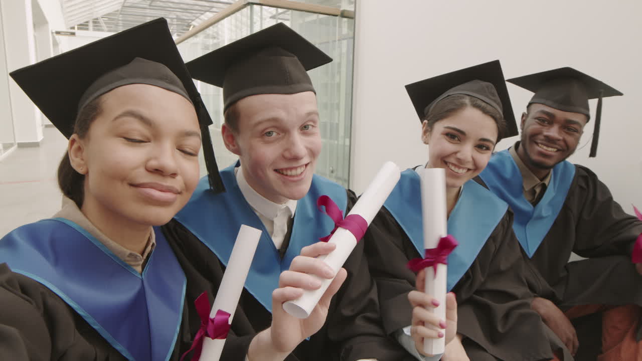 Four Young Classmates Making Selfie during Graduation