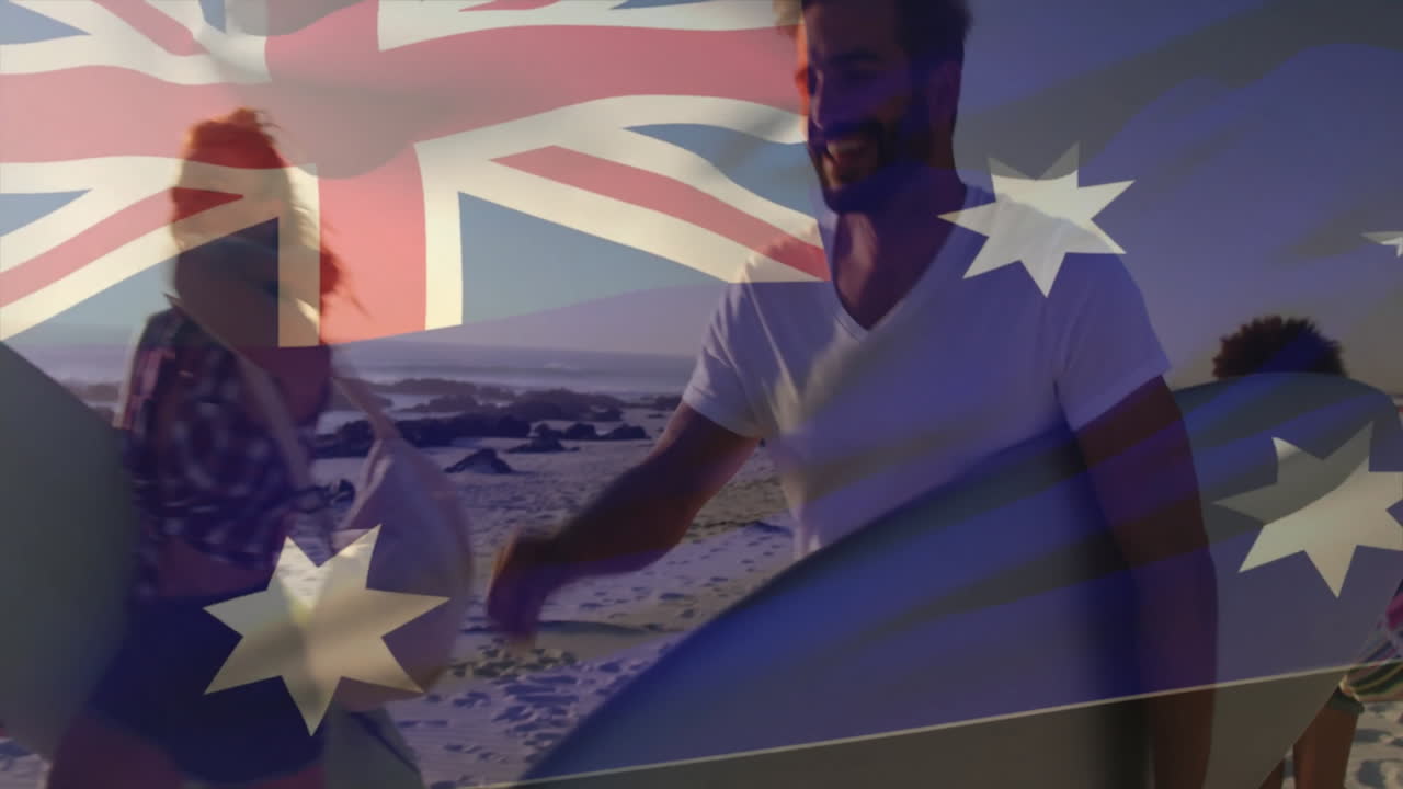 Walking on beach, surfers carrying surfboards with animation of Australian flag