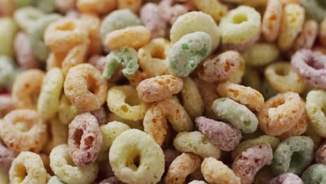 Video-of-colorful-breakfast-round-cereals-on-white-background