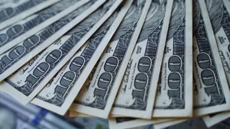 fanning out hundred dollar bills