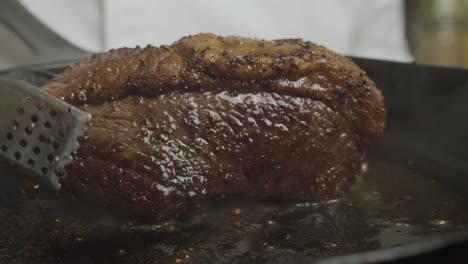 frying meat steak inside frying pan