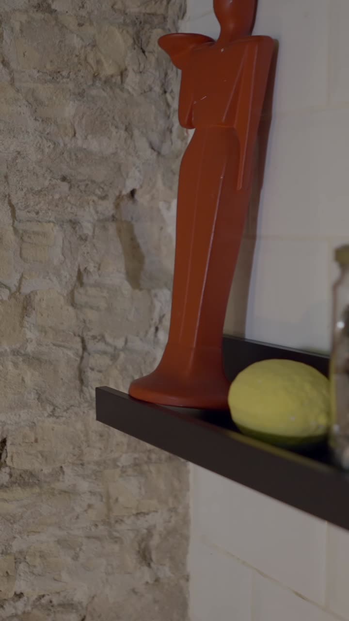 Assorted household items and kitchenware displayed on a shelf
