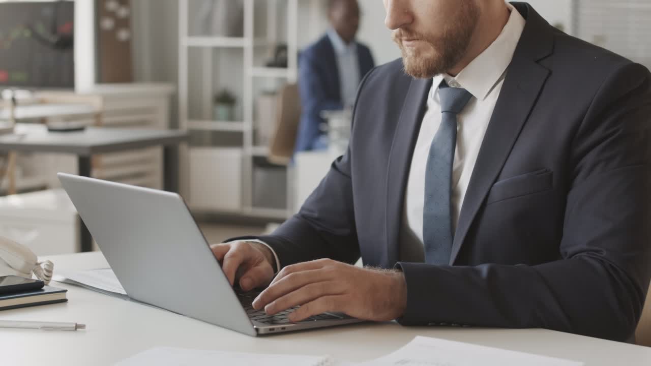 Financial Analyst Working on Laptop at Stock Exchange Company