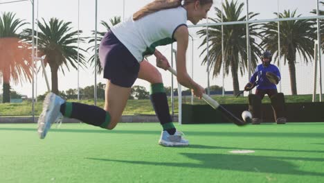 Female-hockey-players-playing-on-the-field