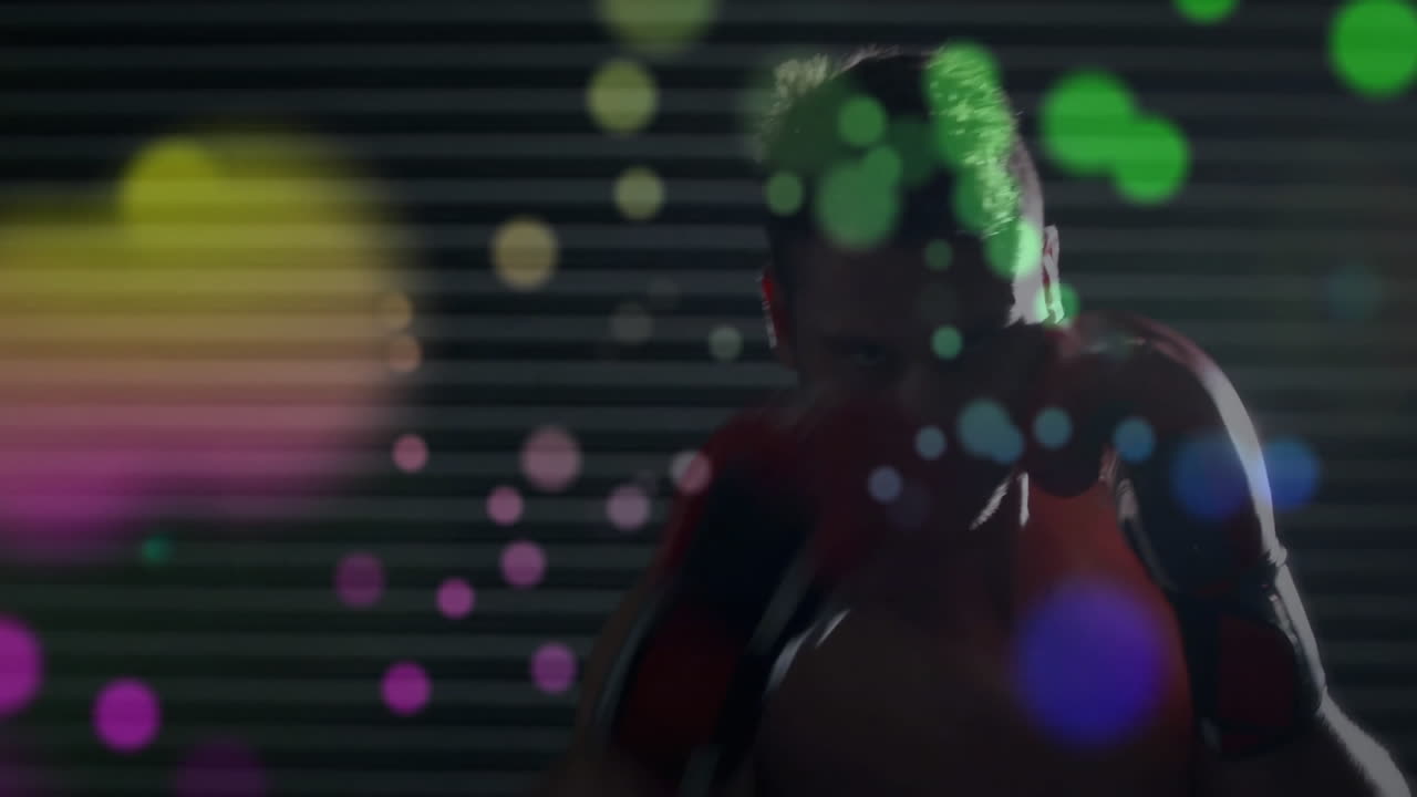 Training boxer with colorful bokeh animation over dark background