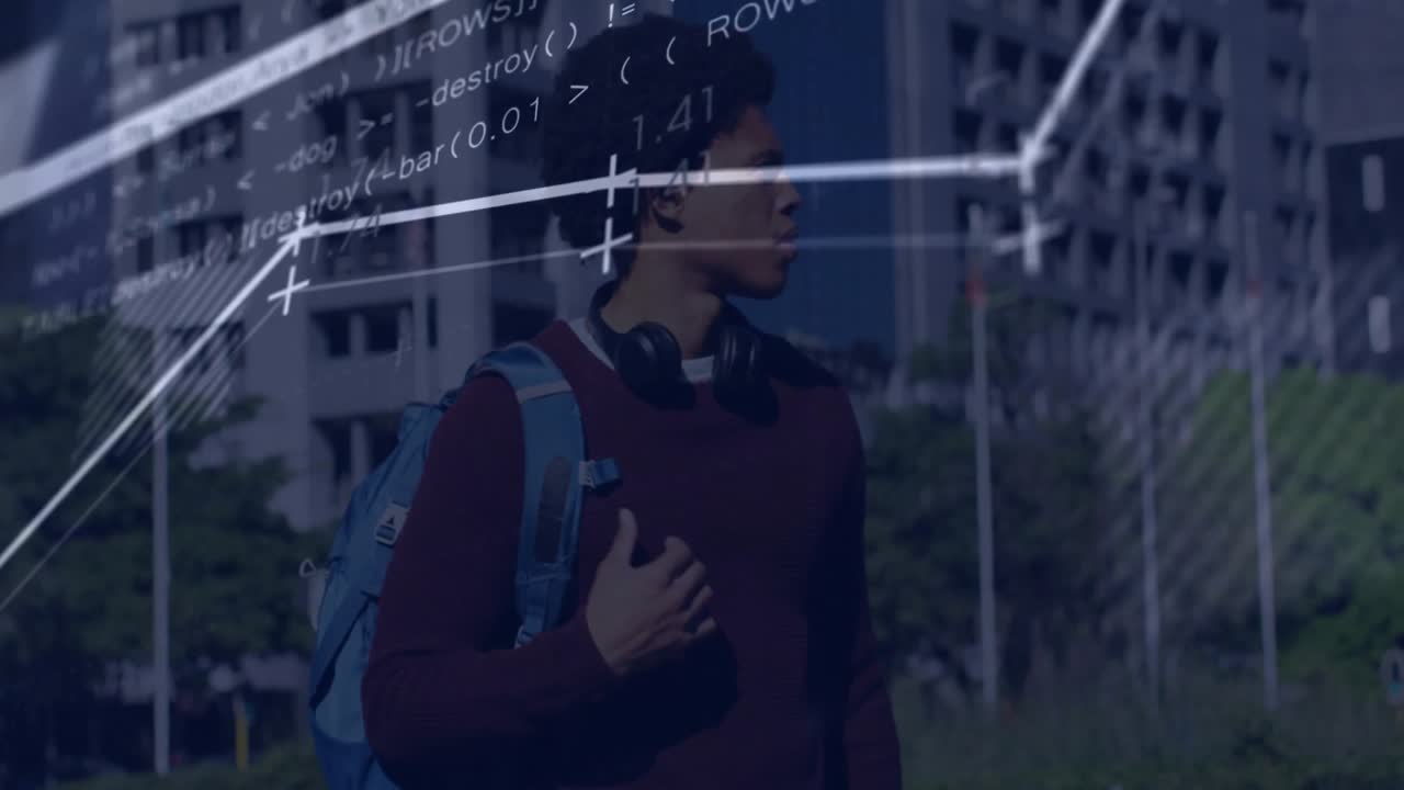 Man walking tech campus walkway carrying blue backpack and wearing headphones showing code charts