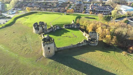 Ancient-Flint-castle-medieval-heritage-military-Welsh-ruins-aerial-view-landmark-rising-over-flight