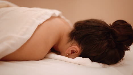 breathing in a towel massage treatment process of spa