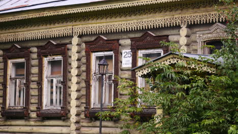 ornate wooden house facade with carved windows