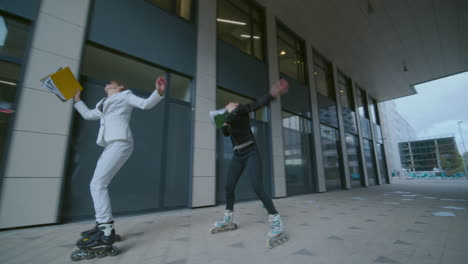 Moving-shot-of-two-business-women-in-classic-outfit-roller-skating-panicky-with-document-folders