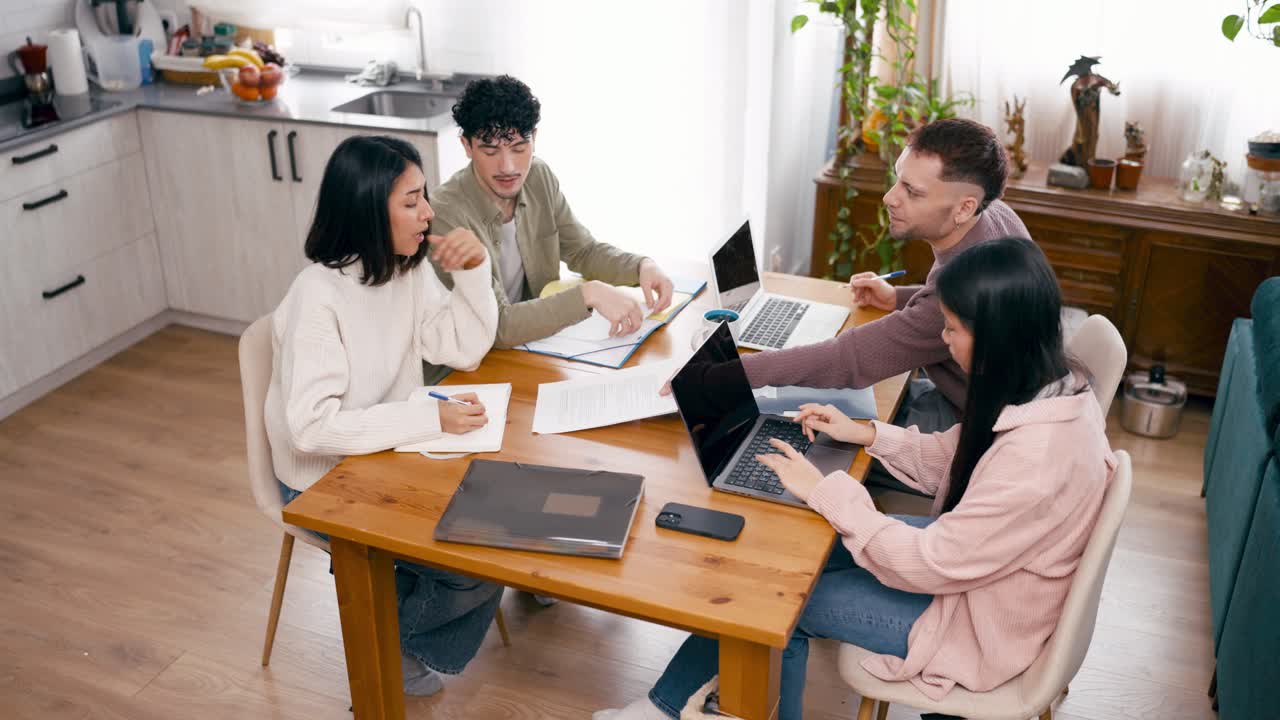Diverse Group of Young Adults Collaborating and Studying at Home