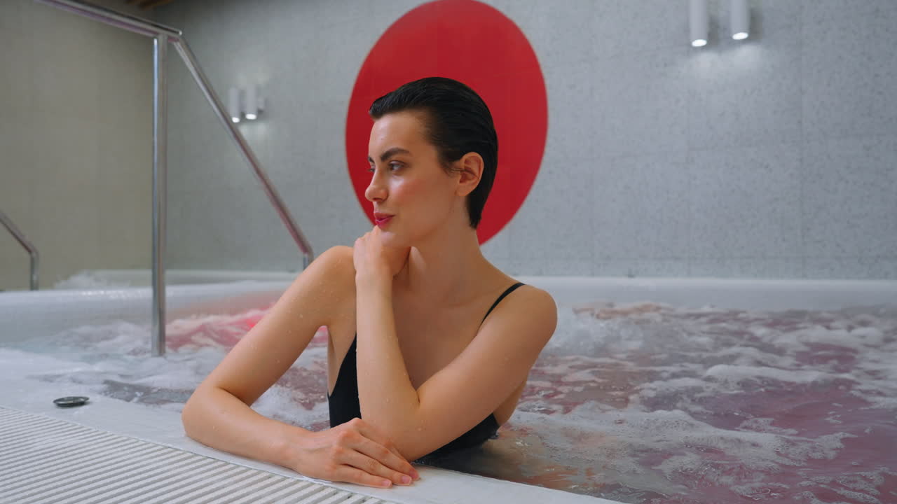 Woman Relaxing in a Modern Spa Hot Tub