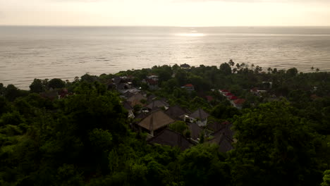 Idyllic-luxurious-vacation-Indonesian-costal-destination,-sunset-aerial