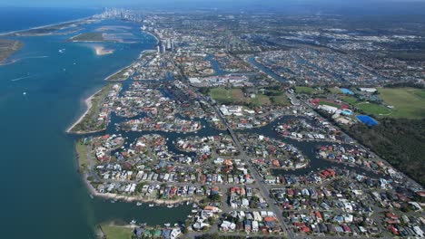 panoramic view of hollywell suburb, runaway bay in queensland, australia - drone shot