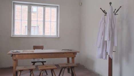 cozy room with stylish decor practical furniture warm atmosphere this video features a cozy room with stylish decor functional furniture like table chairs stools coat rack creating warm inviting atmosphere for gatherings or relaxation