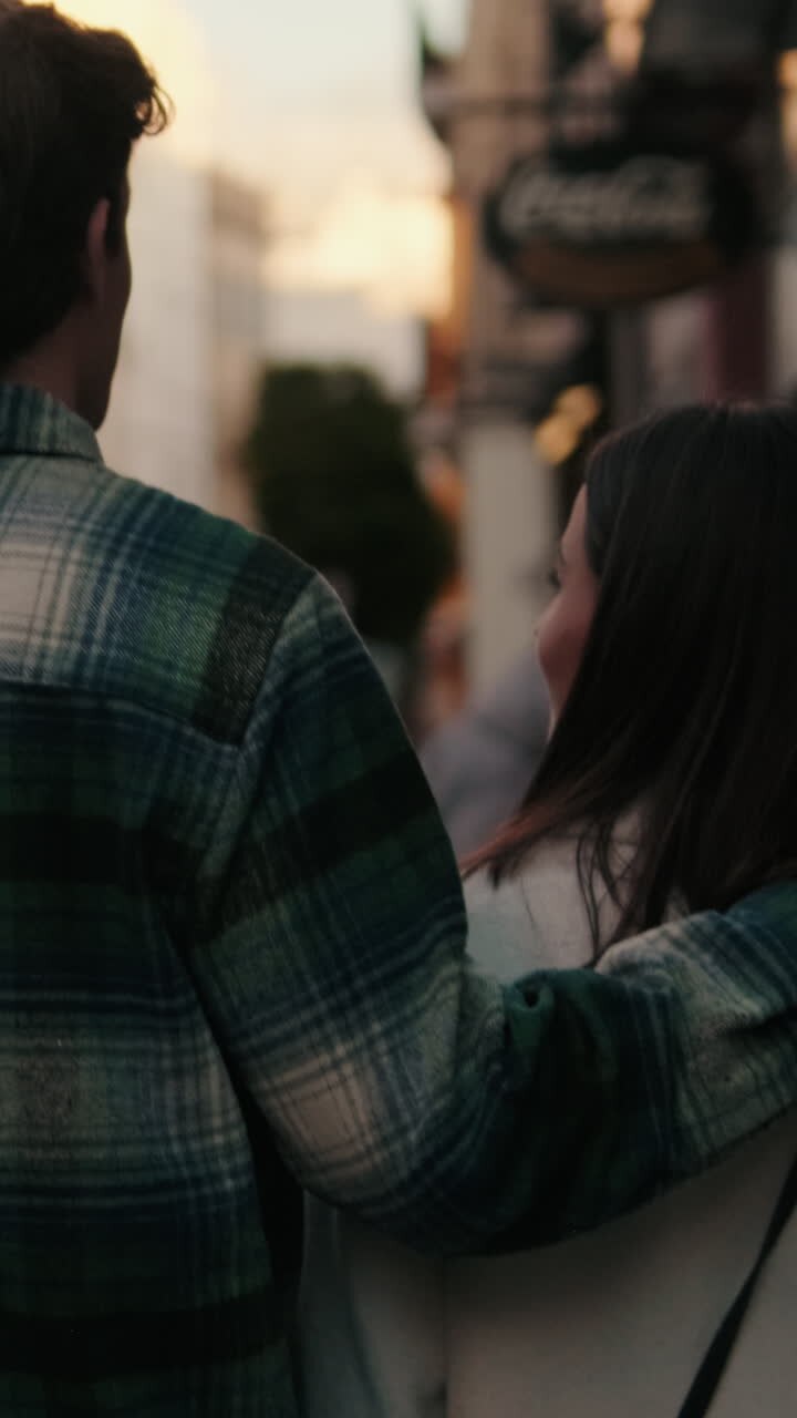 Couple Strolling in Seville at Sunset
