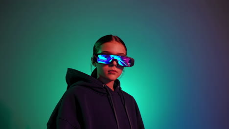 young person with futuristic vr glasses and glowing display