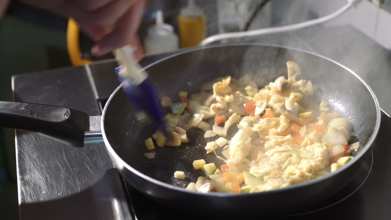 Vegetable stir fry in frying pan. Close up of frying pan with fried vegetables