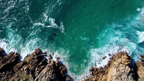 beautiful cornish ocean waves with crystal clear waters crashing over the rocky coastline, cornwall, england, uk