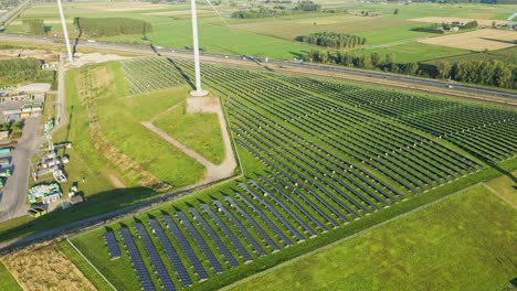 aerial of a large photovoltaic solar panel park on a sunny summer day