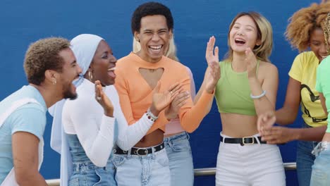 group of diverse and happy people celebrating and laughing together