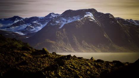 Stunning mountainscape under golden light at the fjord in norway