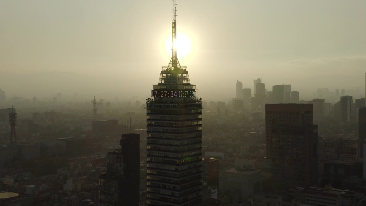 Aerial shot of the Torre Latinoamericana in the Mexico City center. This is one of the oldest skycraper of the city. Is located in near some of the most turistic places of CDMX. With sun backlight
