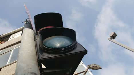 an urban traffic light from a low angle shot