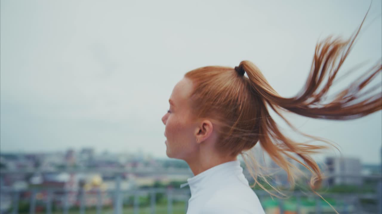 Woman running on a rooftop