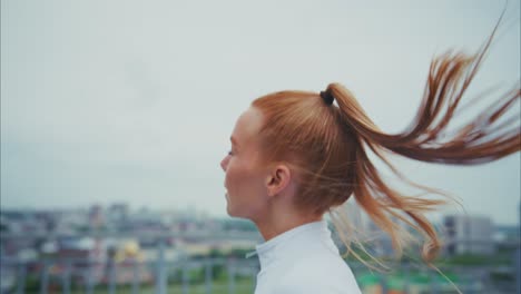 woman running on a rooftop