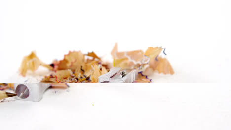 colored shavings with brown color pencil and sharpener in saucer