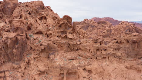 Aztec-Sandstone-revealing-the-texture-and-holes-with-the-valley-of-fire-in-the-background