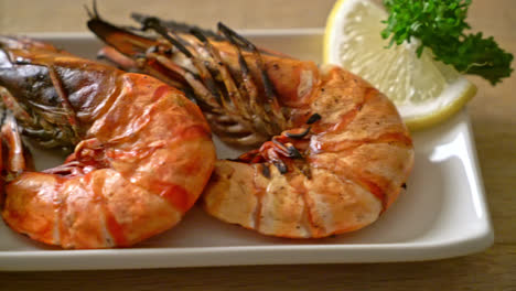 grilled tiger prawns or shrimps with lemon