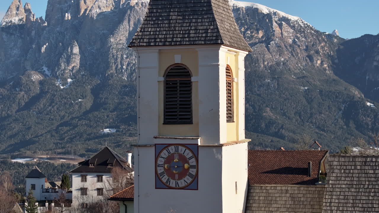 Aerial drone view of the church in Soprabolzano village on the Renon plateau in the Dolomites, Italy