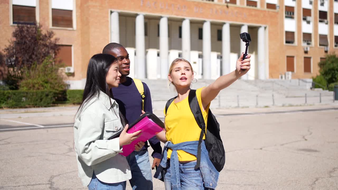 Group of students taking selfie on campus
