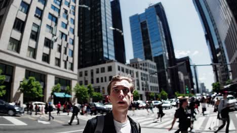 wide-angle shot of a young man in a bustling city street, capturing the urban vibe and dynamic
