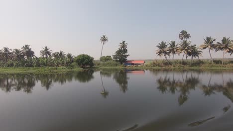 tropical landscape, peaceful river surface, vessel navigate along kerala backwaters, india