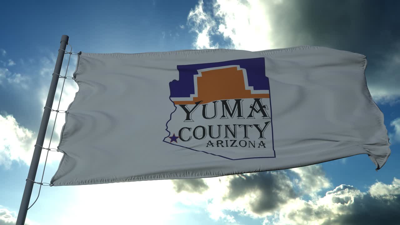 Yuma county flag, state of Arizona, United States of America waving at wind in blue sky