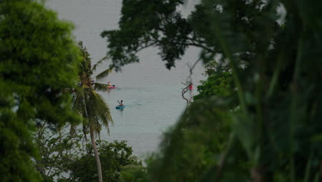 people kayaking during sunset on moso island off coast efate in vanuatu, shefa province