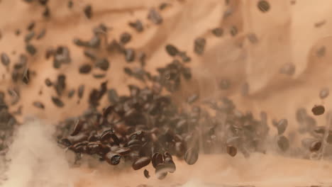 fresh coffee beans barreling toward camera with steam in extreme slow motion