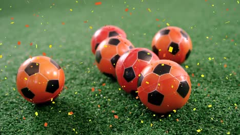 animation of confetti falling over soccer balls