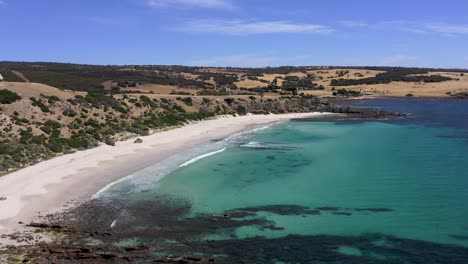 Kangaroo-Island-Stokes-Bay-aerial-with-empty-beach,-turquoise-water-and-hills,-South-Australia