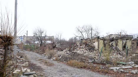 a panning shot documents the widespread destruction of a residential area in kupiansk, ukraine. the ruins of numerous homes serve as stark evidence of heavy russian shelling on the frontline city
