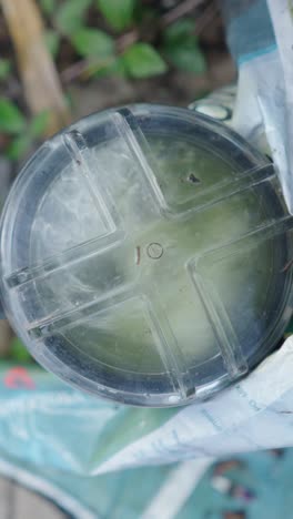 bottom of a clear plastic bottle with '10' marking