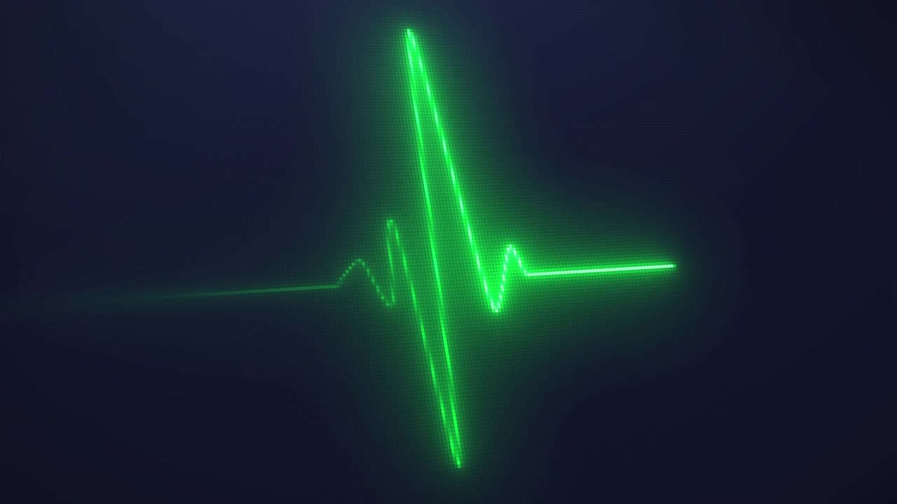 Neon hjertebanken EKG med sort baggrund.