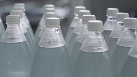 conveyor belt with bottles of drinking water at a modern beverage plant