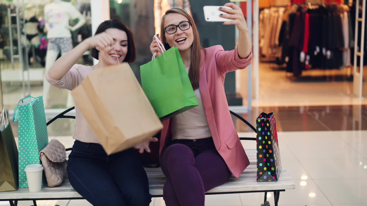Two Friends Taking a Selfie in a Shopping Mall