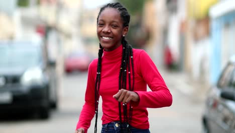 teen girl dancing in street feeling joy and happiness