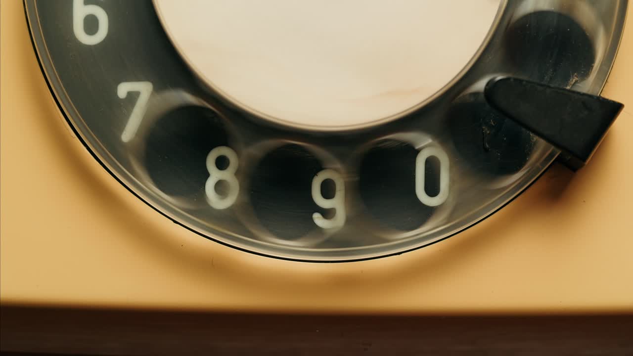 Retro vintage phone, A yellow rotary telephone is displayed on a wooden desk, adding a nostalgic touch