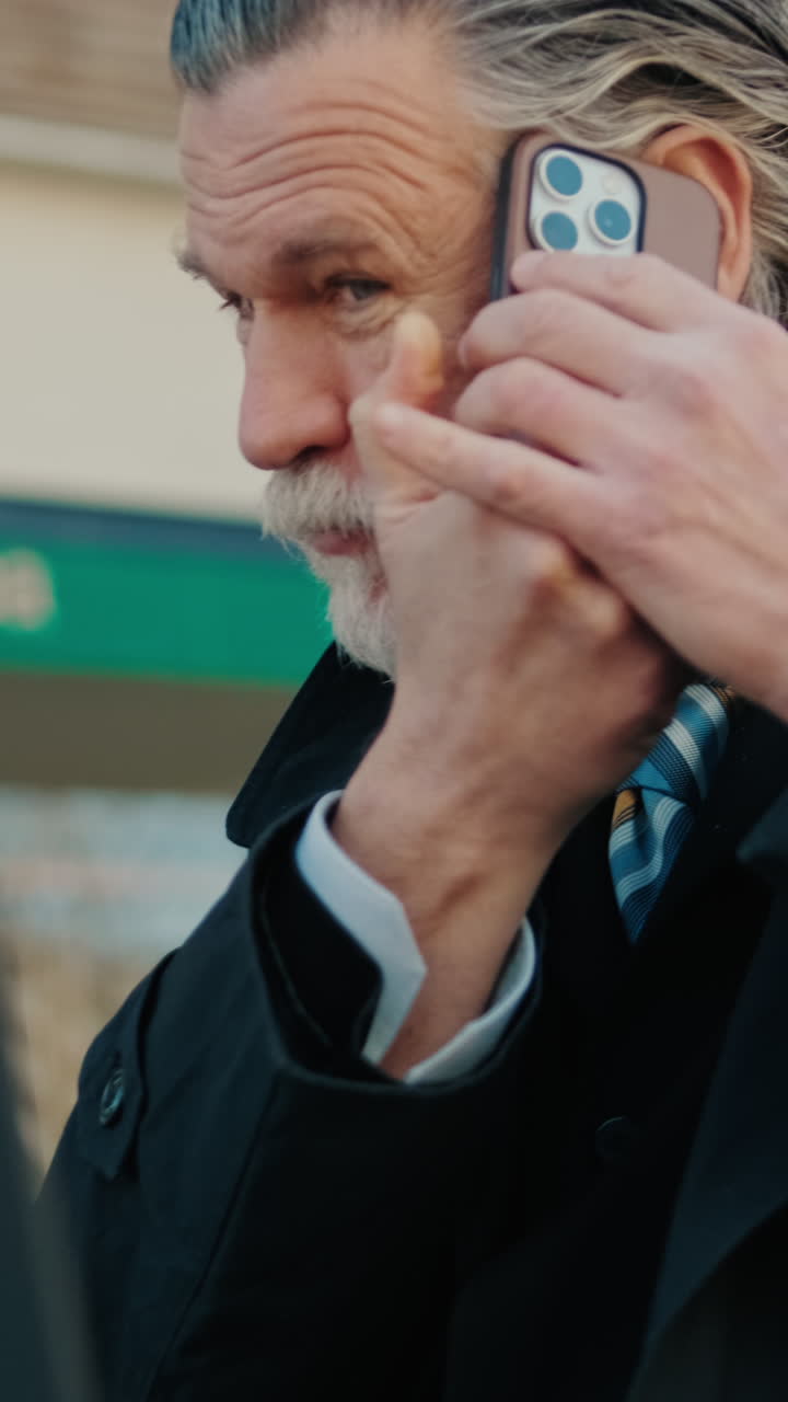 Businessman Working Outdoors on Laptop and Phone